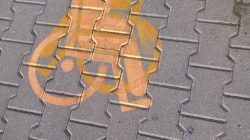 Double-sprayed handicap parking sign